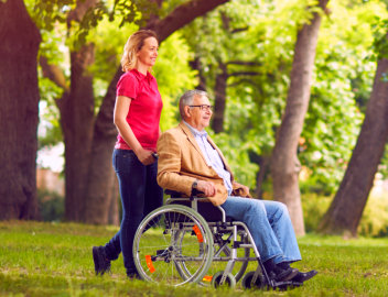 elderly man in the park with his companion
