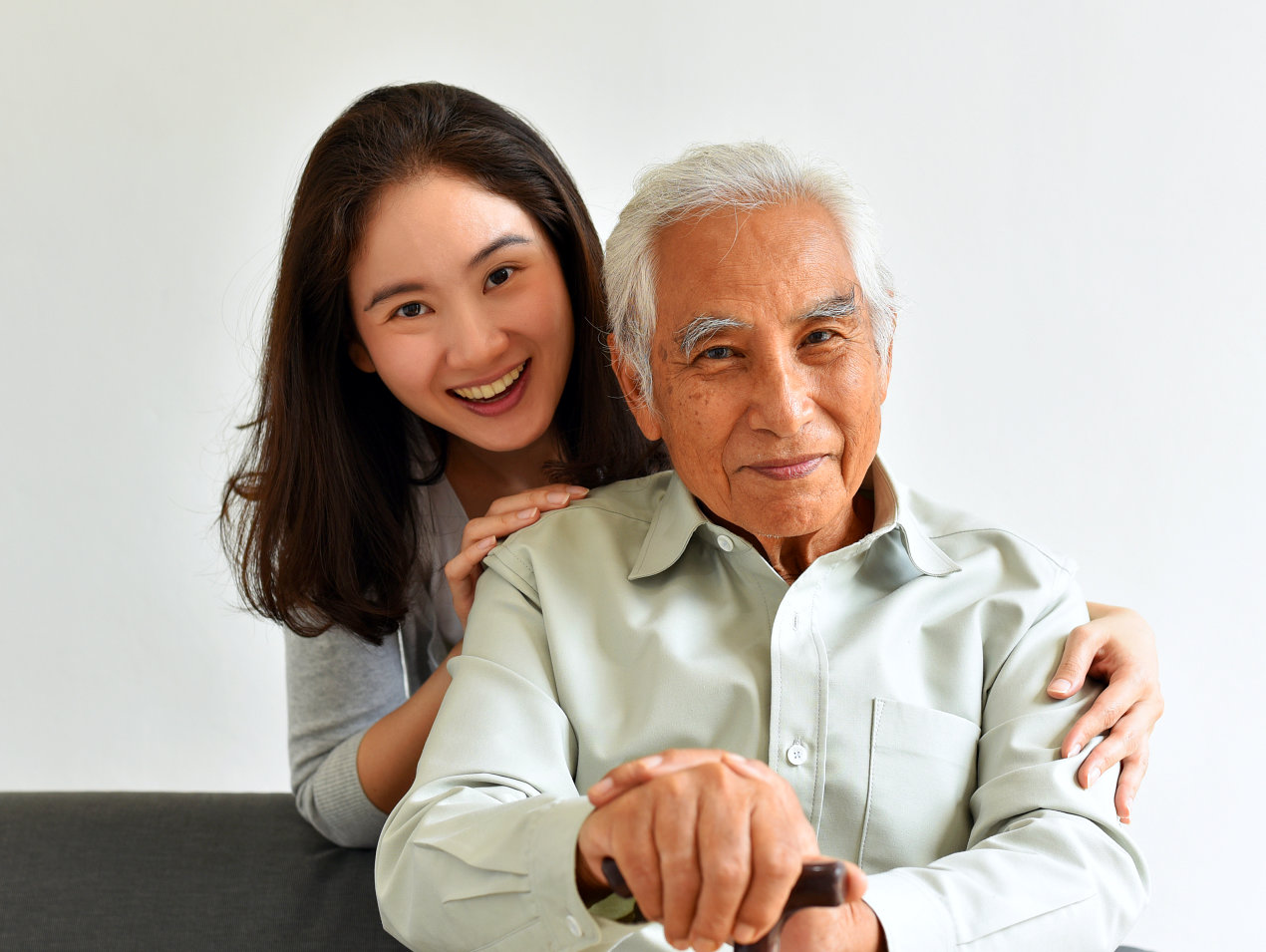 happy elderly man with his female companion