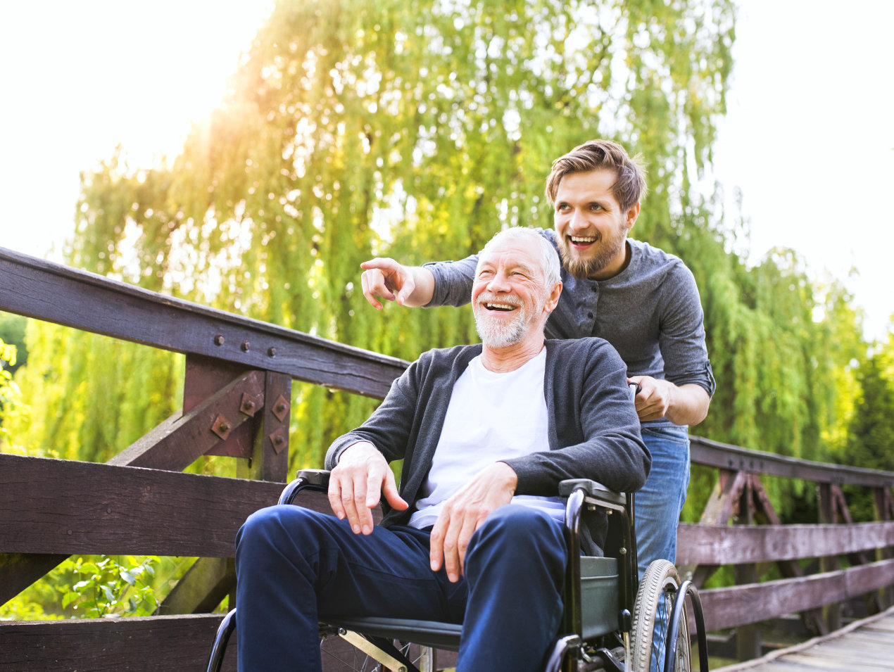 elderly man in wheelchair with his companion